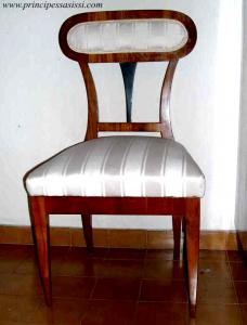 Vienna, 1815-20 approx. Rare chair of the early Viennese Biedermeier period, veneered in cherry wood with a "futuristic" design.